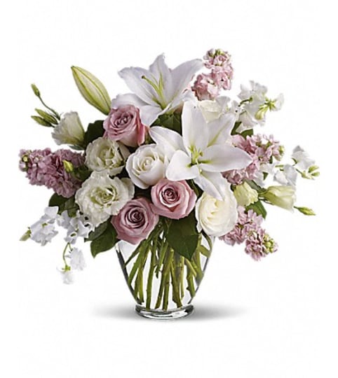 ISN'T IT ROMANTIC. An arrangement by Fine's Flowers. ISN'T IT ROMANTIC. An arrangement by Fine's Flowers.