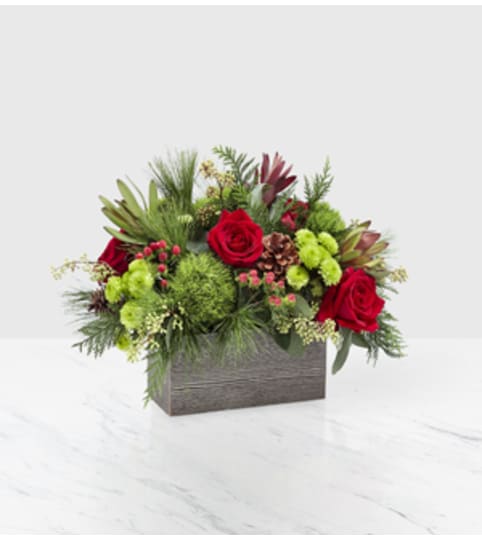 Christmas Cabin. An arrangement by Fine's Flowers.