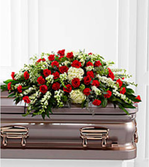 serenity casket spray. An arrangement by Fine's Flowers. serenity casket spray. An arrangement by Fine's Flowers.