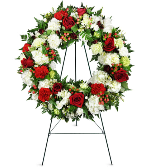 Passionate Faith Sympathy Wreath™. An arrangement by Fine's Flowers. Passionate Faith Sympathy Wreath™. An arrangement by Fine's Flowers.