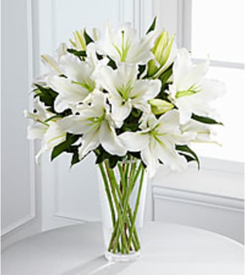 white in your honor. An arrangement by Fine's Flowers. white in your honor. An arrangement by Fine's Flowers.