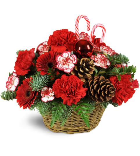Basket Full of Christmastime. An arrangement by Fine's Flowers.