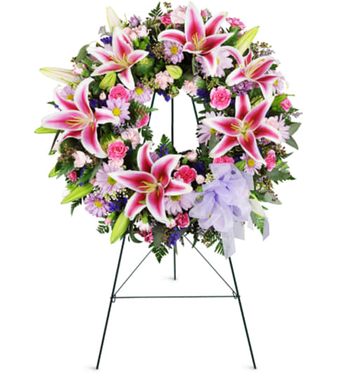 Stargazer Sentiments Wreath™. An arrangement by Fine's Flowers. Stargazer Sentiments Wreath™. An arrangement by Fine's Flowers.