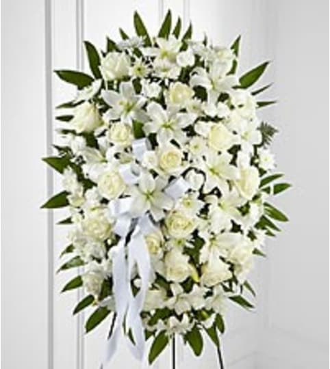 elegant white blooms. An arrangement by Fine's Flowers. elegant white blooms. An arrangement by Fine's Flowers.