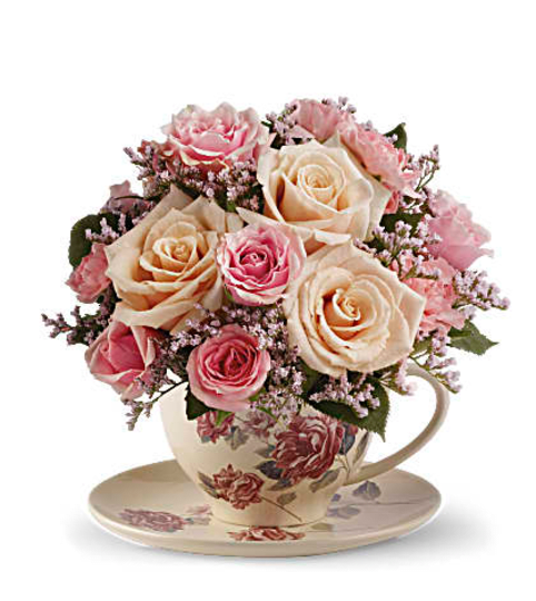 stylish tea cup. An arrangement by Fine's Flowers.