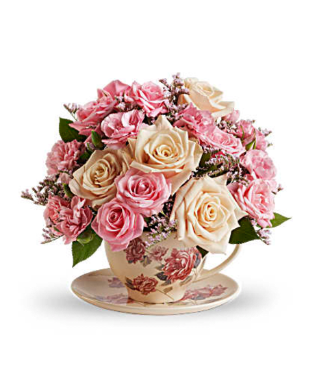 stylish tea cup. An arrangement by Fine's Flowers. stylish tea cup. An arrangement by Fine's Flowers.